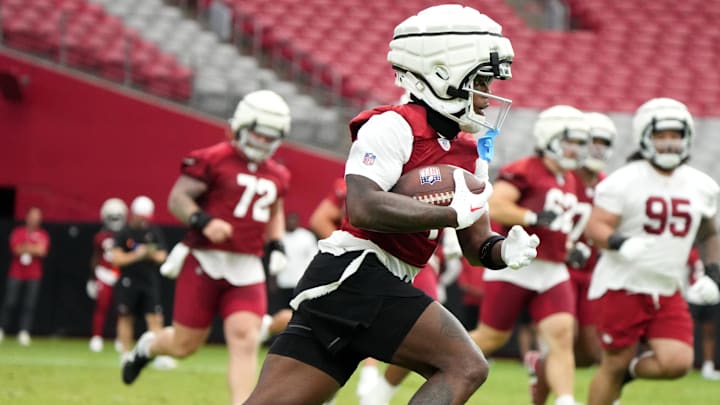 Arizona Cardinals receiver Greg Dortch (4) runs with the ball during training camp at State Farm Stadium in Glendale on July 25, 2024.