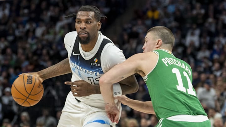 Jan 2, 2025; Minneapolis, Minnesota, USA; Minnesota Timberwolves center Naz Reid (11) dribbles past Boston Celtics guard Payton Pritchard (11) in the second half at Target Center. Mandatory Credit: Jesse Johnson-Imagn Images Jan 2, 2025; Minneapolis, Minnesota, USA; Minnesota Timberwolves center Naz Reid (11) dribbles past Boston Celtics guard Payton Pritchard (11) in the second half at Target Center. Mandatory Credit: Jesse Johnson-Imagn Images