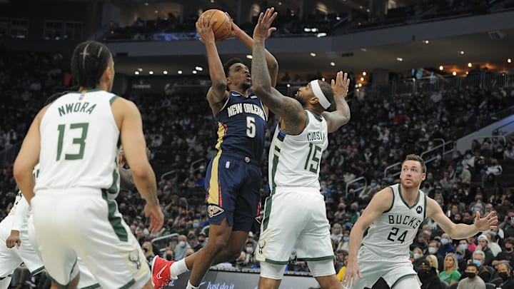 Jan 1, 2022; Milwaukee, Wisconsin, USA;  New Orleans Pelicans forward Herbert Jones (5) drives to the basket against Milwaukee Bucks center DeMarcus Cousins (15) in the first half at Fiserv Forum. Mandatory Credit: Michael McLoone-Imagn Images