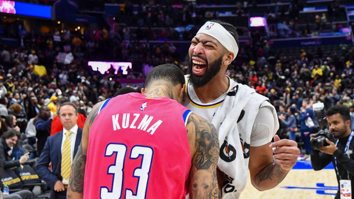 Dec 4, 2022; Washington, District of Columbia, USA; Los Angeles Lakers forward Anthony Davis (3) reacts with Washington Wizards forward Kyle Kuzma (33) after the game  at Capital One Arena. Mandatory Credit: Brad Mills-USA TODAY Sports