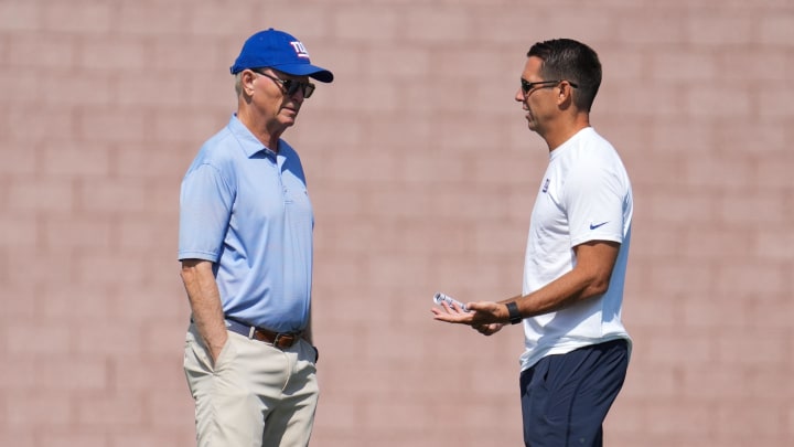 Jul 26, 2024; East Rutherford, NJ, USA; New York Giants owner John Mara, left, and New York Giants general manager Joe Schoen speak during training camp at Quest Diagnostics Training Center.  