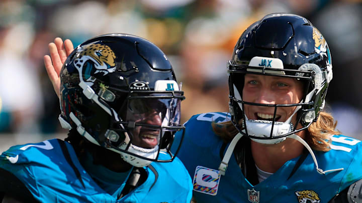 Jacksonville Jaguars quarterback Trevor Lawrence (16) congratulates wide receiver Brian Thomas Jr. (7) on his touchdown score during the third quarter of an NFL football matchup Sunday, Oct. 27, 2024 at EverBank Stadium in Jacksonville, Fla. The Packers edged the Jaguars 30-27 on a last-second field goal. [Corey Perrine/Florida Times-Union]