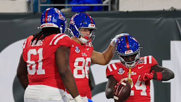 Mississippi Rebels running back Ulysses Bentley IV (24) is congratulated by Mississippi Rebels tight end Caden Prieskorn (86) for his touchdown score during the third quarter of the TaxSlayer Gator Bowl Thursday, Jan. 2, 2025 at EverBank Stadium in Jacksonville, Fla. Ole Miss defeated Duke 52-20. [Corey Perrine/Florida Times-Union]