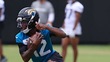 Jacksonville Jaguars wide receiver Travis Hunter (12) runs the ball during a rookie minicamp at Miller Electric Center Saturday, May 10, 2025 in Jacksonville, Fla. [Corey Perrine/Florida Times-Union]