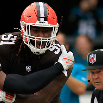 Cleveland Browns defensive end Alex Wright (91) celebrates his sack on Jacksonville Jaguars quarterback Trevor Lawrence (16) in the end zone for a safety with defensive end Ogbo Okoronkwo (54) during the fourth quarter of an NFL football matchup Sunday, Sept. 15, 2024 at EverBank Stadium in Jacksonville, Fla. The Browns defeated the Jaguars 18-13. [Corey Perrine/Florida Times-Union]