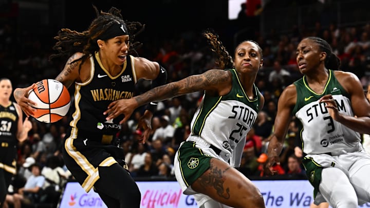 Jul 26, 2025; Washington, District of Columbia, USA; Washington Mystics guard Sug Sutton (1) drives to the basket as Seattle Storm guard Tiffany Mitchell (25) and forward Nneka Ogwumike (3) defend during the third quarter at CareFirst Arena. Jul 26, 2025; Washington, District of Columbia, USA; Washington Mystics guard Sug Sutton (1) drives to the basket as Seattle Storm guard Tiffany Mitchell (25) and forward Nneka Ogwumike (3) defend during the third quarter at CareFirst Arena.