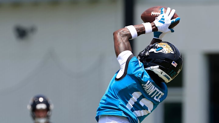 Jacksonville Jaguars wide receiver Travis Hunter (12) hauls in a reception during the first organized team activity at Miller Electric Center Monday, May 19, 2025 in Jacksonville, Fla.