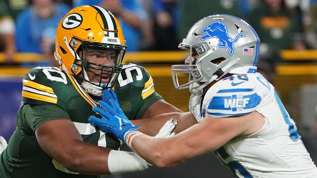 Sep 28, 2023; Green Bay, Wisconsin, USA; Green Bay Packers guard Zach Tom (50) moves in against Detroit Lions linebacker Jack Campbell (46) during the first quarter at Lambeau Field. Mandatory Credit: Mark Hoffman-Imagn Images