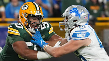 Sep 28, 2023; Green Bay, Wisconsin, USA; Green Bay Packers guard Zach Tom (50) moves in against Detroit Lions linebacker Jack Campbell (46) during the first quarter at Lambeau Field. Mandatory Credit: Mark Hoffman-Imagn Images