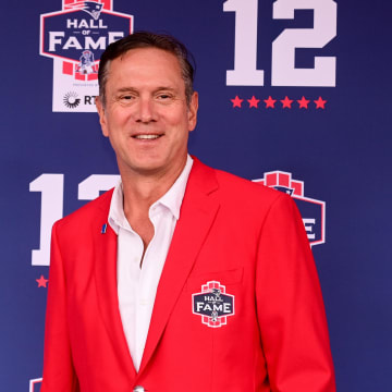 Former Patriots quarterback Drew Bledsoe poses for a photo at the New England Patriots Hall of Fame induction ceremony for Tom Brady at Gillette Stadium.