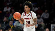 Mar 13, 2025; Charlotte, NC, USA; Louisville Cardinals guard Chucky Hepburn (24) with the ball in the first half at Spectrum Center. Mandatory Credit: Bob Donnan-Imagn Images