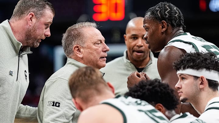 Michigan State head coach Tom Izzo talks to forward Coen Carr (55) at a timeout against Wisconsin during the first half of Big Ten Tournament semifinal at Gainbridge Fieldhouse in Indianapolis, Ind. on Saturday, March 15, 2025.