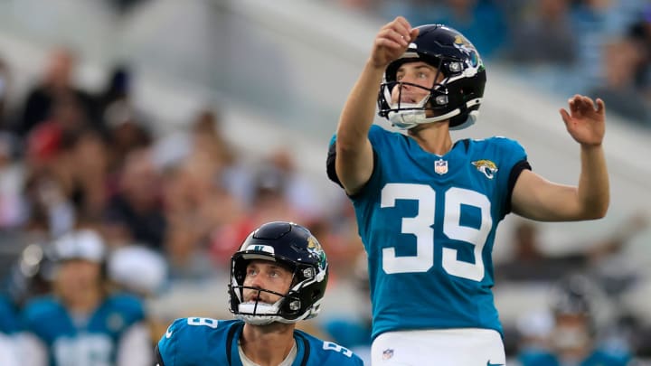 Jacksonville Jaguars place kicker Cam Little (39) kicks his first field goal as punter Logan Cooke (9) who held, looks on, during the second quarter of a preseason NFL football game Saturday, Aug. 10, 2024 at EverBank Stadium in Jacksonville, Fla. [Corey Perrine/Florida Times-Union]