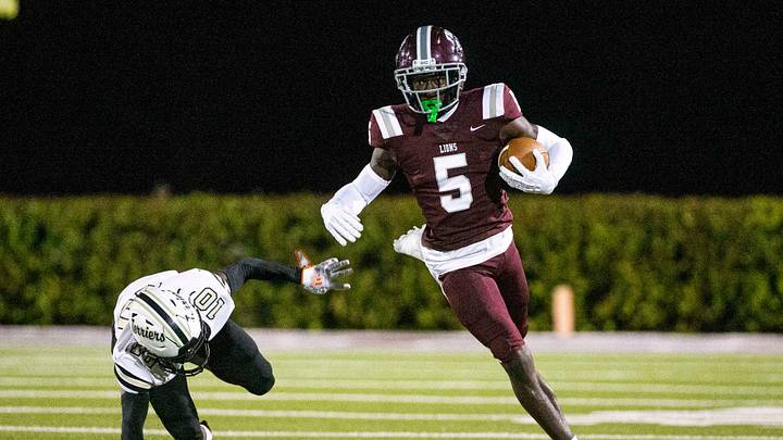 Winston Watkins from FBA gains yards against Moore Haven during the Class 1S-Region 4 championship
