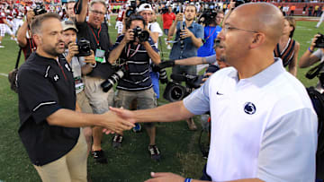Former Temple and current Nebraska football head coach Matt Rhule shakes hands with Penn State football head coach James Franklin