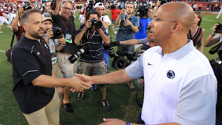 Former Temple and current Nebraska football head coach Matt Rhule shakes hands with Penn State football head coach James Franklin