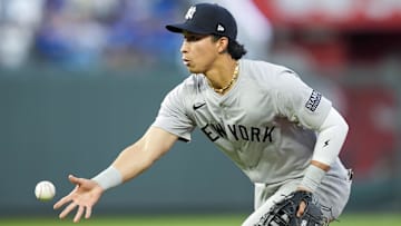 Oct 9, 2024; Kansas City, Missouri, USA; New York Yankees third base Oswaldo Cabrera (95) flips to first base during the second inning against the Kansas City Royals in game three of the ALDS for the 2024 MLB Playoffs at Kauffman Stadium. Mandatory Credit: Jay Biggerstaff-Imagn Images