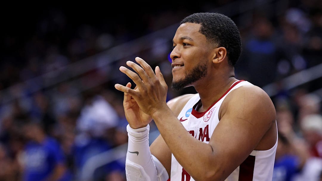 Mar 27, 2025; Newark, NJ, USA; Alabama Crimson Tide guard Chris Youngblood (8) celebrates on the bench during the second half against the Brigham Young Cougars during an East Regional semifinal of the 2025 NCAA tournament at Prudential Center. Mandatory Credit: Vincent Carchietta-Imagn Images