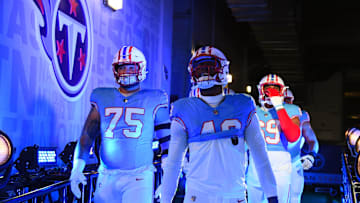 Dec 17, 2023; Nashville, Tennessee, USA; Tennessee Titans linebacker Arden Key (49) and offensive tackle Dillon Radunz (75) walk to the field before the game against the Houston Texans at Nissan Stadium. Mandatory Credit: Christopher Hanewinckel-Imagn Images