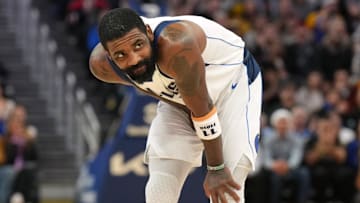 Dec 15, 2024; San Francisco, California, USA; Dallas Mavericks guard Kyrie Irving (11) reacts after suffering an injury during the fourth quarter against the Golden State Warriors at Chase Center. Mandatory Credit: Darren Yamashita-Imagn Images
