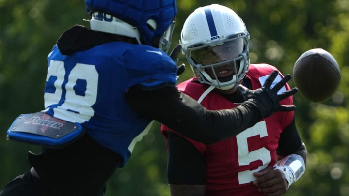 Indianapolis Colts quarterback Anthony Richardson (5) throws the ball to running back Jonathan Taylor (28) during the Colts’ training camp Wednesday, July 31, 2024, at Grand Park Sports Complex in Westfield.