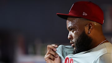 Jose Alvarado wipes sweat off of his face as he faces a divisional rival in the New York Mets