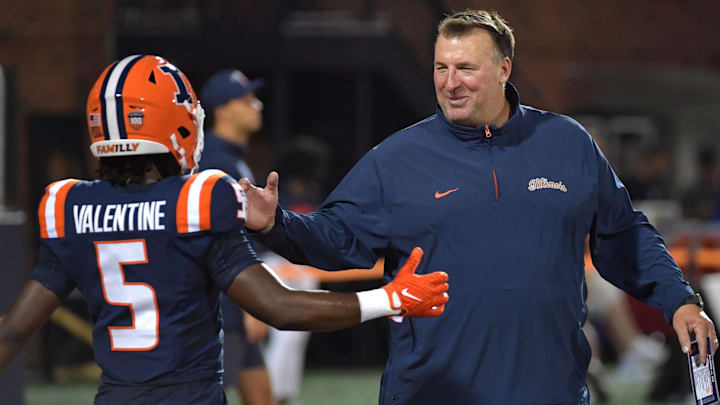 Aug 29, 2024; Champaign, Illinois, USA;  Illinois Fighting Illini head coach Bret Bielema greets running back Ca'Lil Valentine (5) before the first half at Memorial Stadium. Mandatory Credit: Ron Johnson-Imagn Images