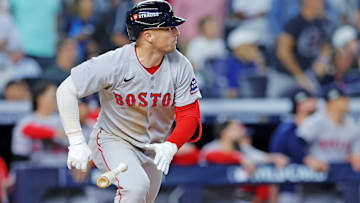 Boston Red Sox third base Alex Bregman (2) hits an RBI double during the ninth inning against the New York Yankees during game one of the Wildcard round for the 2025 MLB playoffs at Yankee Stadium.