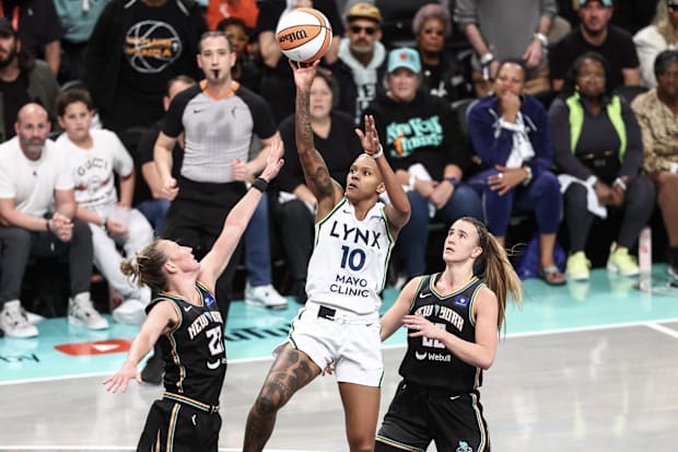 Oct 10, 2024; Brooklyn, New York, USA;  Lynx’ Courtney Williams shoots over Liberty’s Courtney Vandersloot in WNBA Finals.