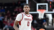 Nov 21, 2024; Spokane, Washington, USA; Washington State Cougars guard Cedric Coward (0) controls the ball against the Eastern Washington Eagles in the second half at Spokane Veterans Memorial Arena. Mandatory Credit: James Snook-Imagn Images