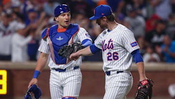 Aug 27, 2025; New York City, New York, USA; New York Mets starting pitcher Nolan McLean (26) fist bumps catcher Hayden Senger (30) after the bottom of the eighth inning against the Philadelphia Phillies at Citi Field. Mandatory Credit: Vincent Carchietta-Imagn Images