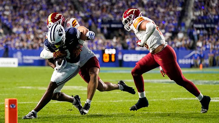 Oct 9, 2026; Provo, Utah, USA; Iowa State Cyclones safety Eddie Lemos (19) makes a tackle on BYU Cougars wide receiver Legend Glasker (1) during the second half at LaVell Edwards Stadium. Mandatory Credit: Aaron Baker-Imagn Images