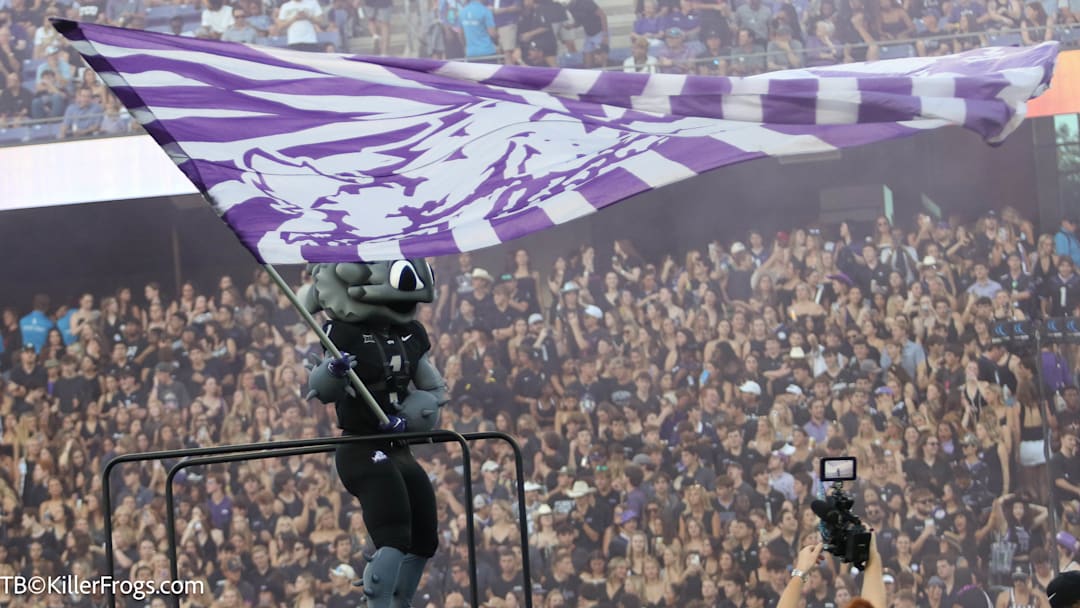 Super Frog welcomes the TCU Horned Frogs onto the field at the beginning of the Colorado game. 