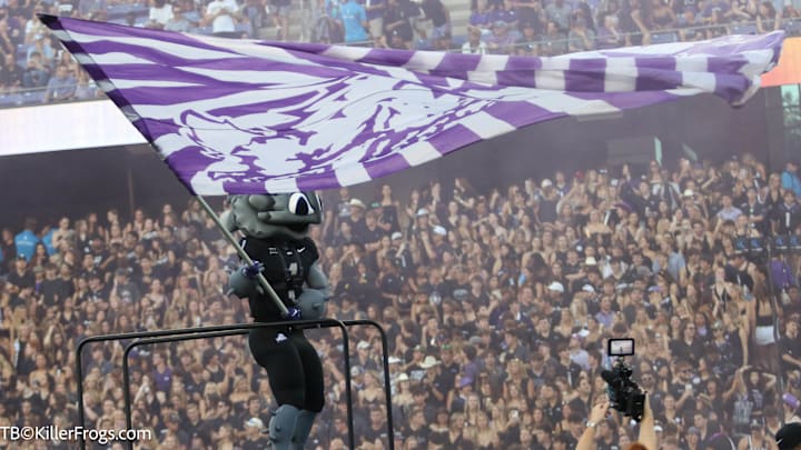 Super Frog welcomes the TCU Horned Frogs onto the field at the beginning of the Colorado game. Super Frog welcomes the TCU Horned Frogs onto the field at the beginning of the Colorado game.