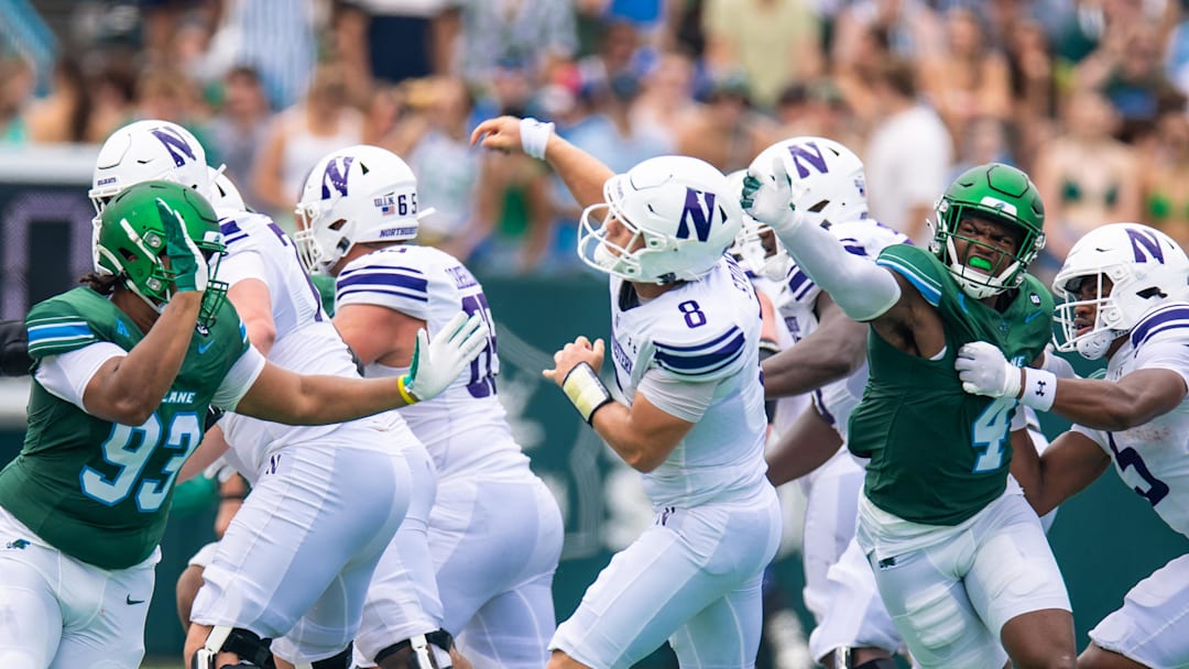 Aug 30, 2025; New Orleans, Louisiana, USA; Tulane Green Wave linebacker Chris Rodgers (4) tips the pass from Northwestern Wildcats quarterback Preston Stone (8) which is intercepted by Tulane Green Wave defensive back Javion White (not pictured) during the first half at Yulman Stadium. Mandatory Credit: Stephen Lew-Imagn Images Aug 30, 2025; New Orleans, Louisiana, USA; Tulane Green Wave linebacker Chris Rodgers (4) tips the pass from Northwestern Wildcats quarterback Preston Stone (8) which is intercepted by Tulane Green Wave defensive back Javion White (not pictured) during the first half at Yulman Stadium. Mandatory Credit: Stephen Lew-Imagn Images