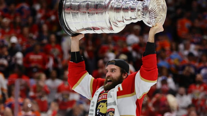 Jun 24, 2024; Sunrise, Florida, USA; Florida Panthers defenseman Aaron Ekblad (5) hoists the Stanley Cup after defeating the Edmonton Oilers in game seven of the 2024 Stanley Cup Final at Amerant Bank Arena. Mandatory Credit: Sam Navarro-USA TODAY Sports