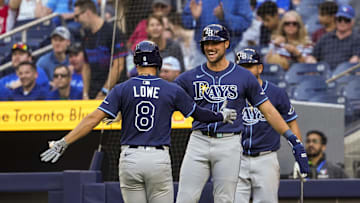 Tampa Bay second baseman Brandon Lowe (8) celebrates his home run against the Toronto Blue Jays with teammate Josh Lowe.