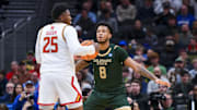 Mar 23, 2025; Seattle, WA, USA; Maryland Terrapins center Derik Queen (25) controls the ball against Colorado State Rams forward Jaylen Crocker-Johnson (8) in the first half at Climate Pledge Arena. Mandatory Credit: Steven Bisig-Imagn Images