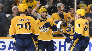 Apr 16, 2025; Nashville, Tennessee, USA;  Nashville Predators defenseman Justin Barron (20) celebrates his goal with his teammates against the Dallas Stars during the first period at Bridgestone Arena. Mandatory Credit: Steve Roberts-Imagn Images