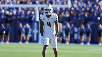Oct 12, 2024; Provo, Utah, USA; Arizona Wildcats wide receiver Tetairoa McMillan (4) gets ready for a play against the Brigham Young Cougars during the third quarter at LaVell Edwards Stadium. Mandatory Credit: Rob Gray-Imagn Images