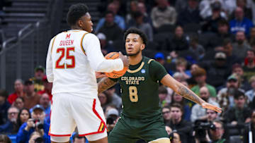 Mar 23, 2025; Seattle, WA, USA; Maryland Terrapins center Derik Queen (25) controls the ball against Colorado State Rams forward Jaylen Crocker-Johnson (8) in the first half at Climate Pledge Arena. Mandatory Credit: Steven Bisig-Imagn Images
