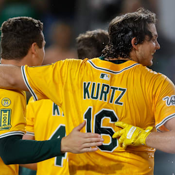 Jun 19, 2025; West Sacramento, California, USA; Athletics first baseman Nick Kurtz (16) celebrates with teammates after hitting a walk-off two run home run during the tenth inning against the Houston Astros at Sutter Health Park. Mandatory Credit: Sergio Estrada-Imagn Images