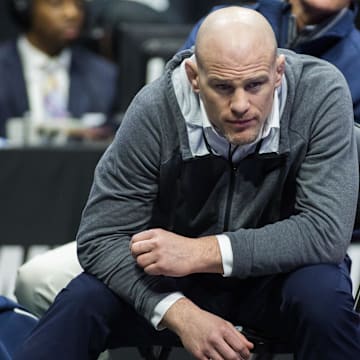 Penn State wrestling coach Cael Sanderson watches a match during the 2023 NCAA Wrestling Championships. 