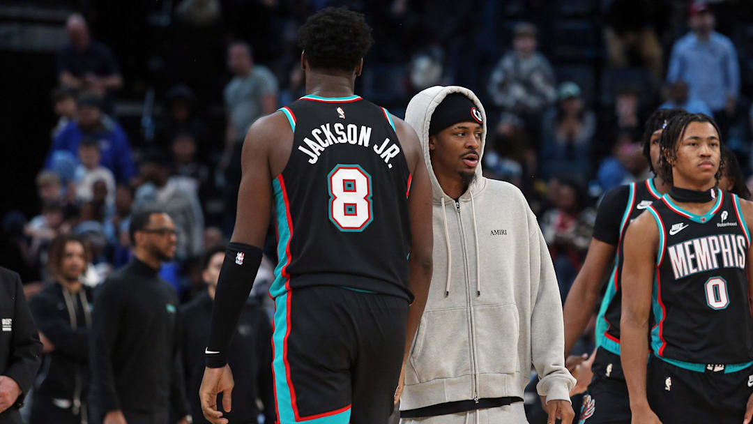 Jan 9, 2026; Memphis, Tennessee, USA; Memphis Grizzlies guard Ja Morant (right) reacts with Memphis Grizzlies forward/center Jaren Jackson Jr. (8) after the game against the Oklahoma City Thunder at FedExForum. Mandatory Credit: Petre Thomas-Imagn Images