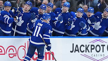 Mar 13, 2025; Toronto, Ontario, CAN; Toronto Maple Leafs center Max Domi (11) celebrates at the bench after scoring a goal against the Florida Panthers during the third period at Scotiabank Arena. Mandatory Credit: Nick Turchiaro-Imagn Images