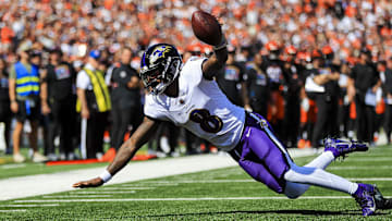 Oct 6, 2024; Cincinnati, Ohio, USA; Baltimore Ravens quarterback Lamar Jackson (8) advances the ball in the first half against the Cincinnati Bengals at Paycor Stadium. Mandatory Credit: Katie Stratman-Imagn Images