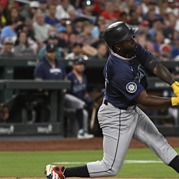 Seattle Mariners left fielder Randy Arozarena (56) hits a sacrifice fly against the St. Louis Cardinals in the fifth inning at Busch Stadium on Sept 6.