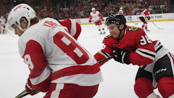 Nov 6, 2024; Chicago, Illinois, USA; Chicago Blackhawks center Connor Bedard (98) checks Detroit Red Wings right wing Patrick Kane (88) during the first period at United Center. Mandatory Credit: David Banks-Imagn Images