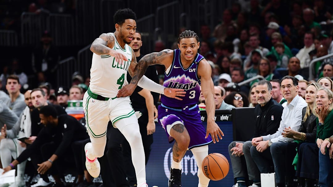 Nov 3, 2025; Boston, Massachusetts, USA; Utah Jazz guard Keyonte George (3) controls the ball while Boston Celtics guard Anfernee Simons (4) defends during the second half at TD Garden. Mandatory Credit: Bob DeChiara-Imagn Images