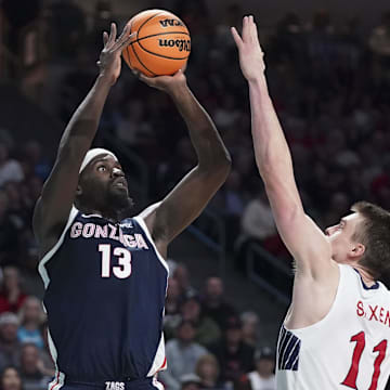 March 12, 2024; Las Vegas, NV, USA; Gonzaga Bulldogs forward Graham Ike (13) shoots the basketball against Saint Mary's Gaels center Mitchell Saxen (11) during the second half in the finals of the WCC Basketball Championship at Orleans Arena.